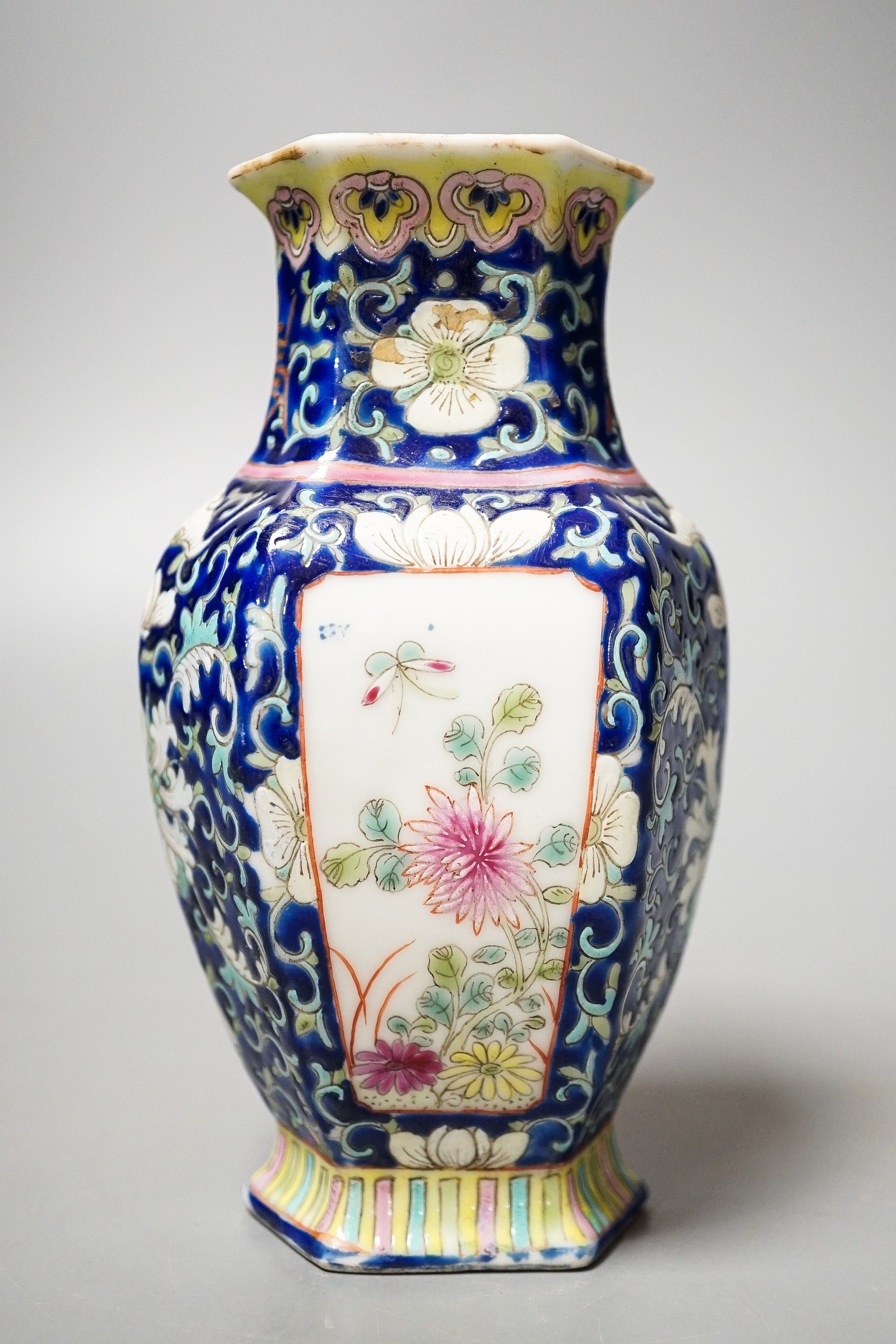A Chinese blue ground famille rose hexagonal vase, late 19th century, 15cm